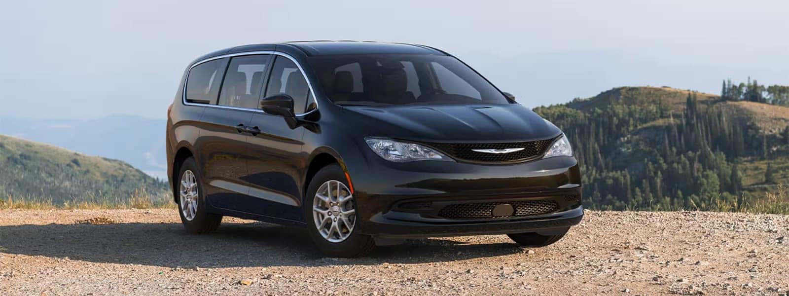 2026 Chrysler Voyager LX minivan, front three quarter view on a scenic overlook