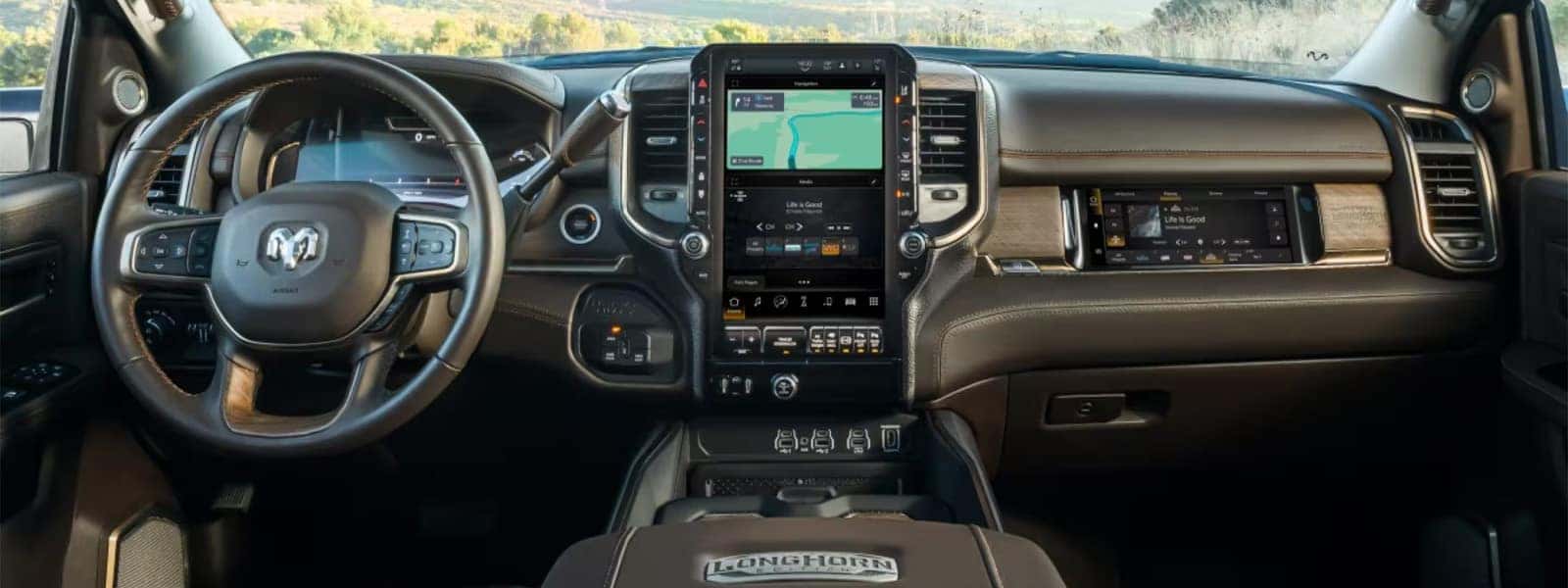 2026 RAM 3500 interior dashboard showing large infotainment touchscreen, digital driver display, and heavy duty truck cabin technology