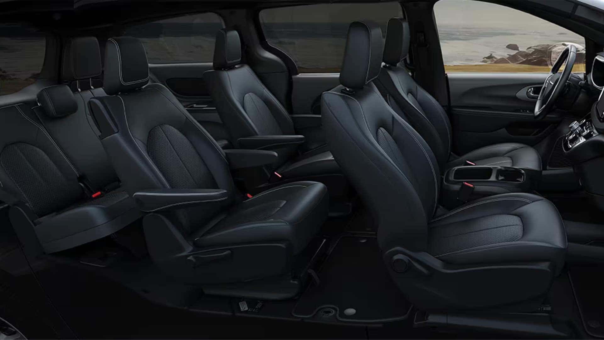 2026 Chrysler Voyager interior with three-row seating, black Caprice leatherette seats, and spacious family cabin layout