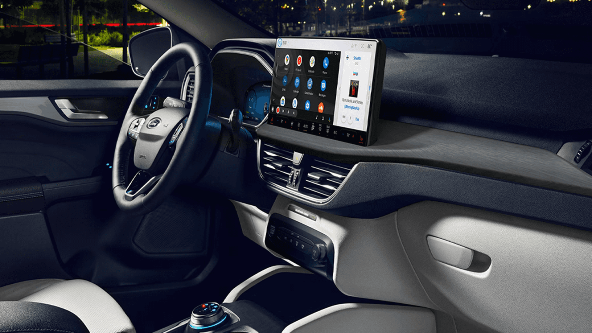 Night interior of 2026 Ford Escape showing large tablet display with app grid and media panel