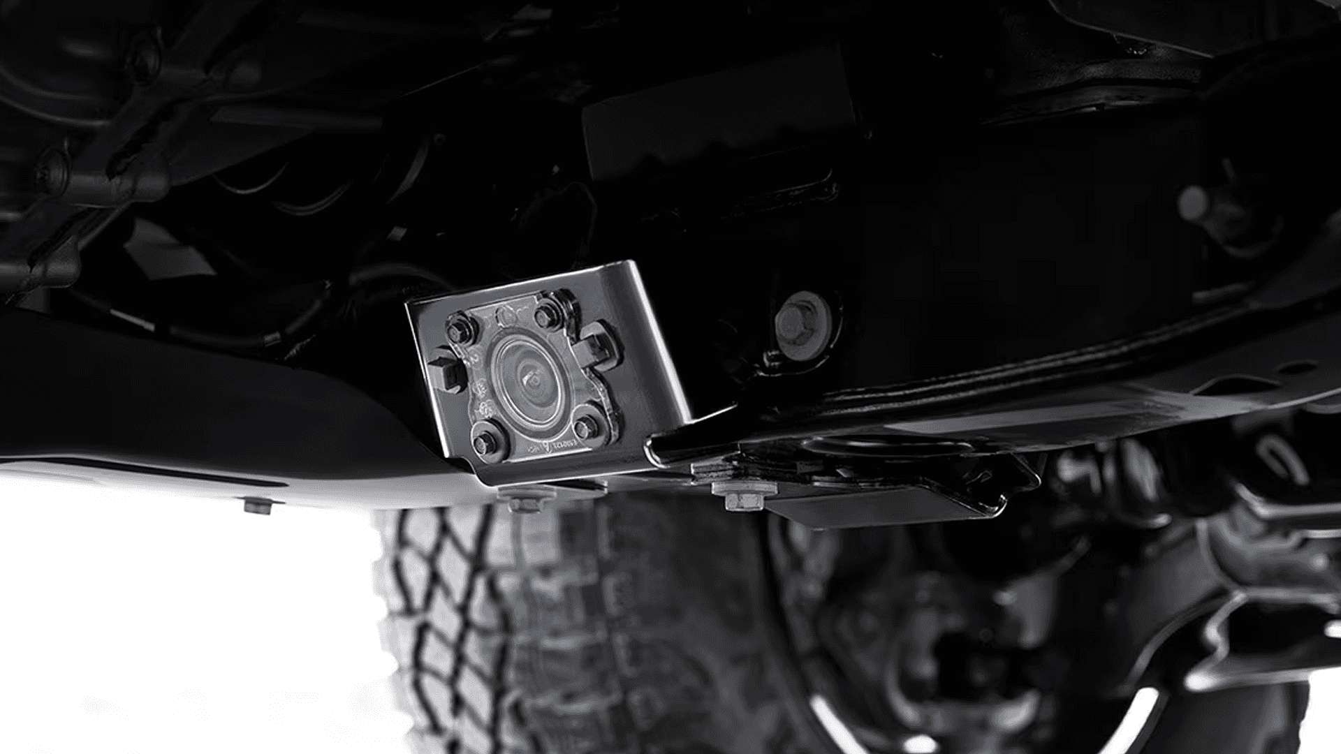 Close up of 2026 GMC Canyon trailer hitch camera mounted under the truck to help align the hitch when connecting a trailer