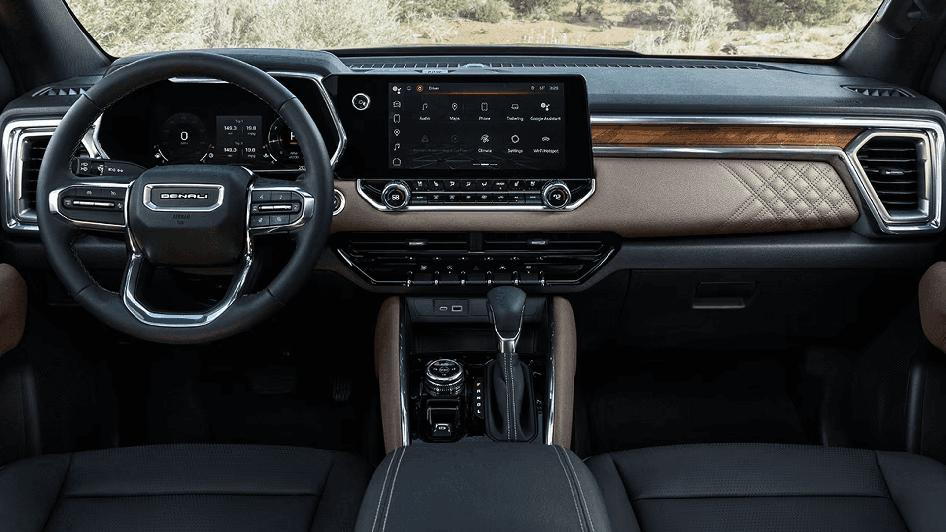 2026 GMC Canyon Denali interior with quilted leather dash trim, wood accents, center touchscreen, and premium cabin materials