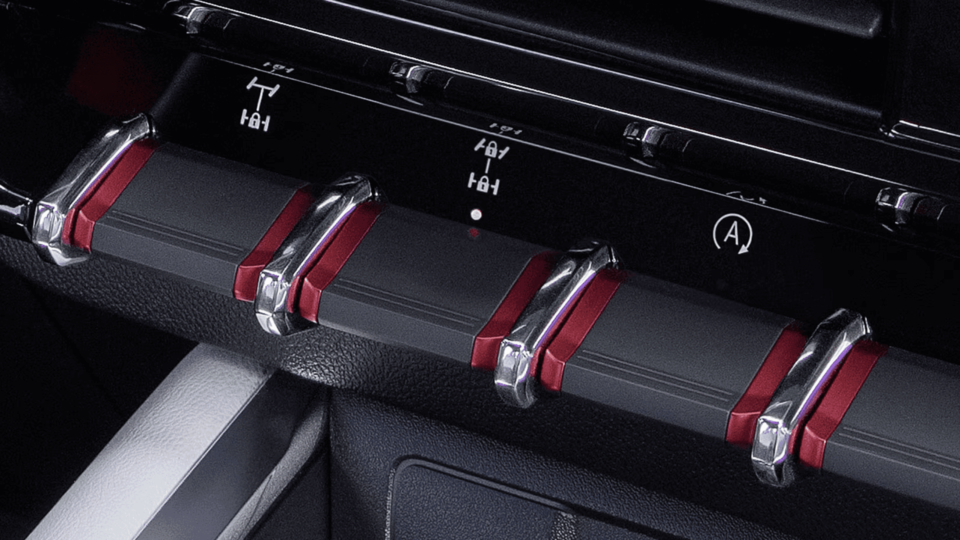 Interior toggle switches in the 2026 GMC Canyon for off road controls including differential locks and drive features.