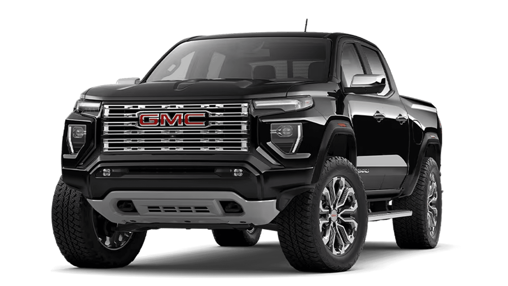 Front three quarter view of the 2026 GMC Canyon showing bold grille design, off road stance, and large wheels.