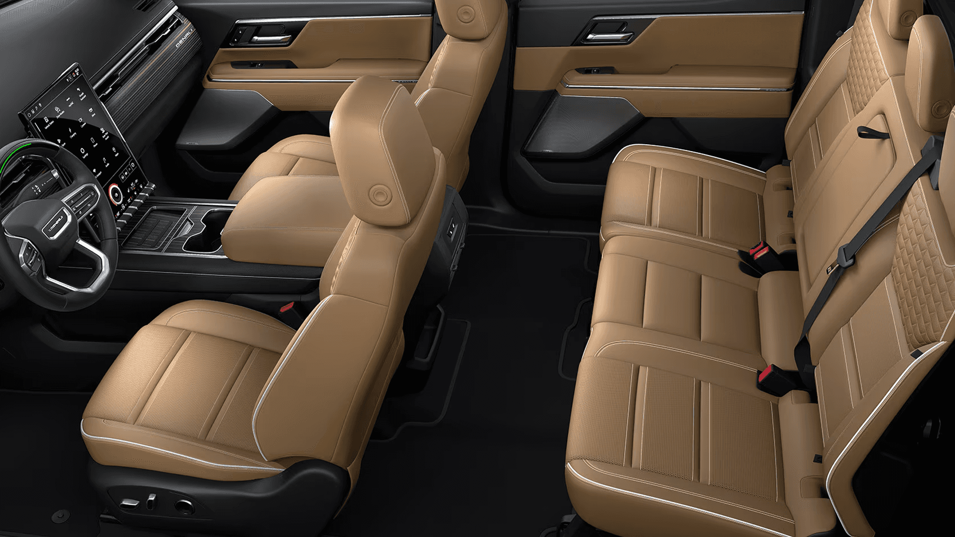 Tan front and rear seats with center console and dashboard visible inside GMC Sierra EV interior