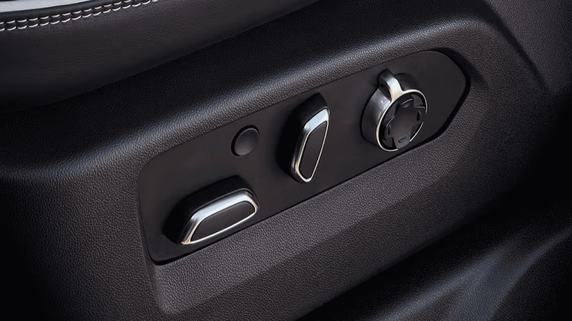 Power seat adjustment controls inside the 2026 GMC Sierra HD with multi-way settings for lumbar, tilt, and seat positioning