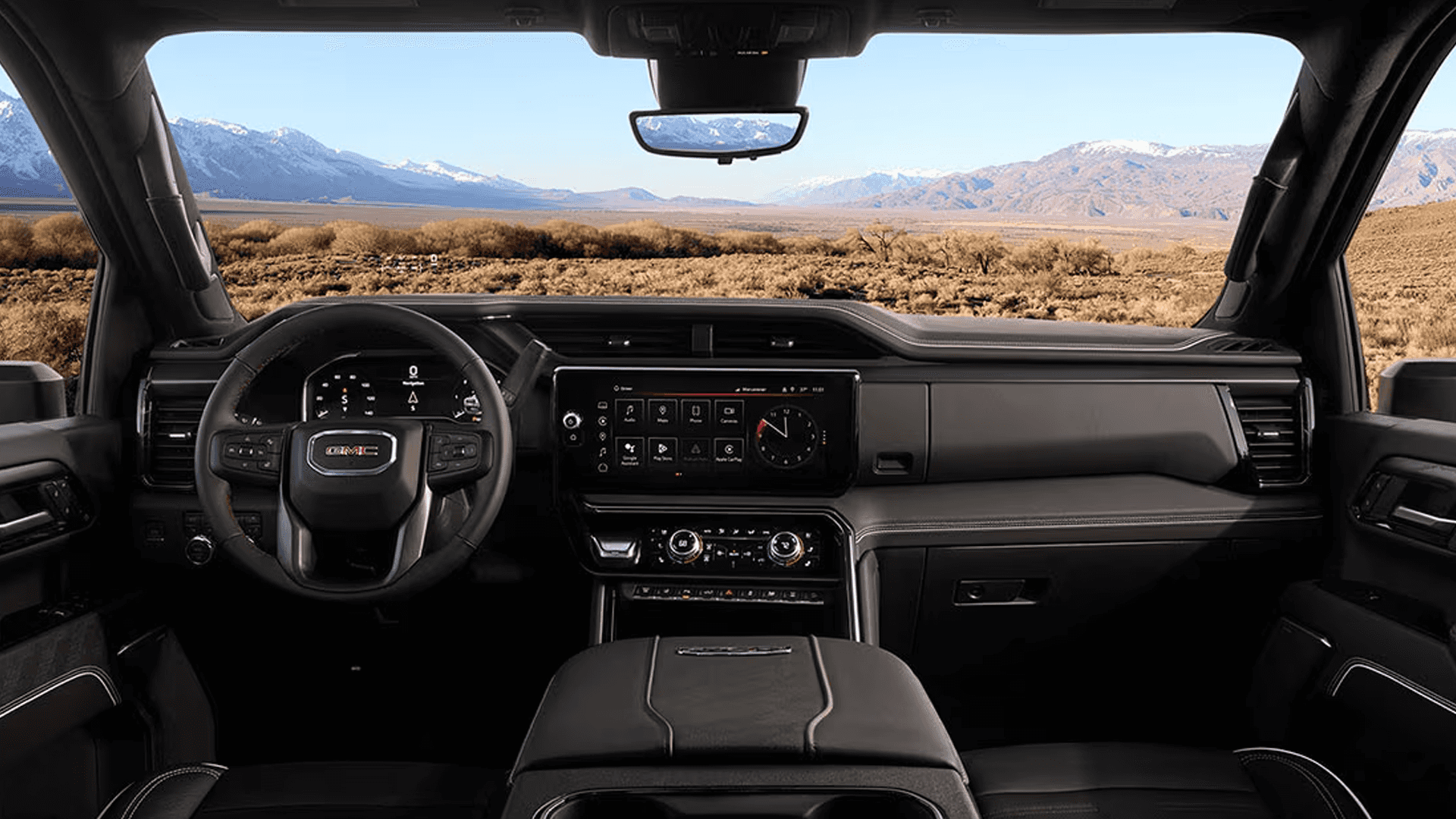 Wide interior view of the 2026 GMC Sierra HD cabin with dashboard layout, center console, and large infotainment display