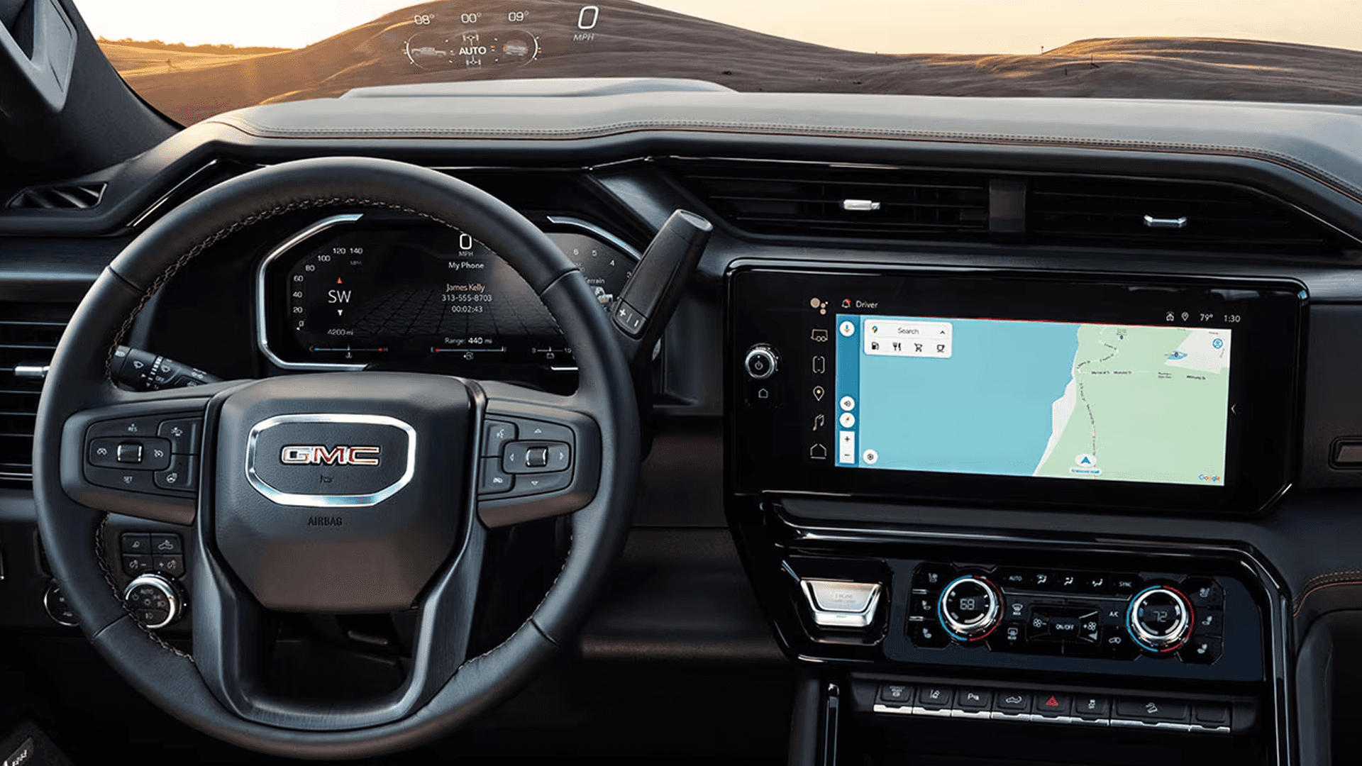 Interior view of the 2026 GMC Sierra HD showing the digital driver display and large center touchscreen with navigation.