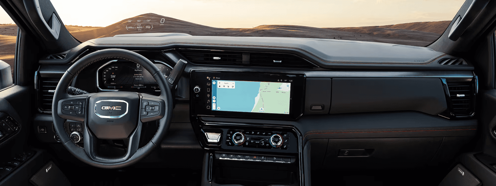 Close view of Sierra HD digital display and touchscreen interface showing driver alerts and connected vehicle information.