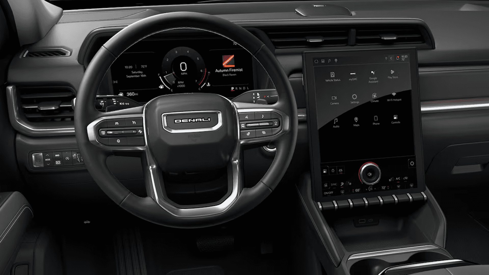 Front cabin overview of the 2026 GMC Terrain showing steering wheel, digital gauge cluster, and large center touchscreen