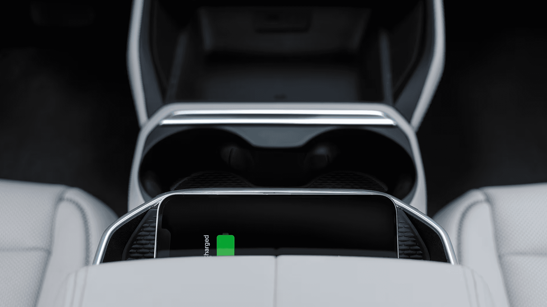 Wireless smartphone charging pad in the 2026 GMC Terrain center console with cupholders and front seat storage area