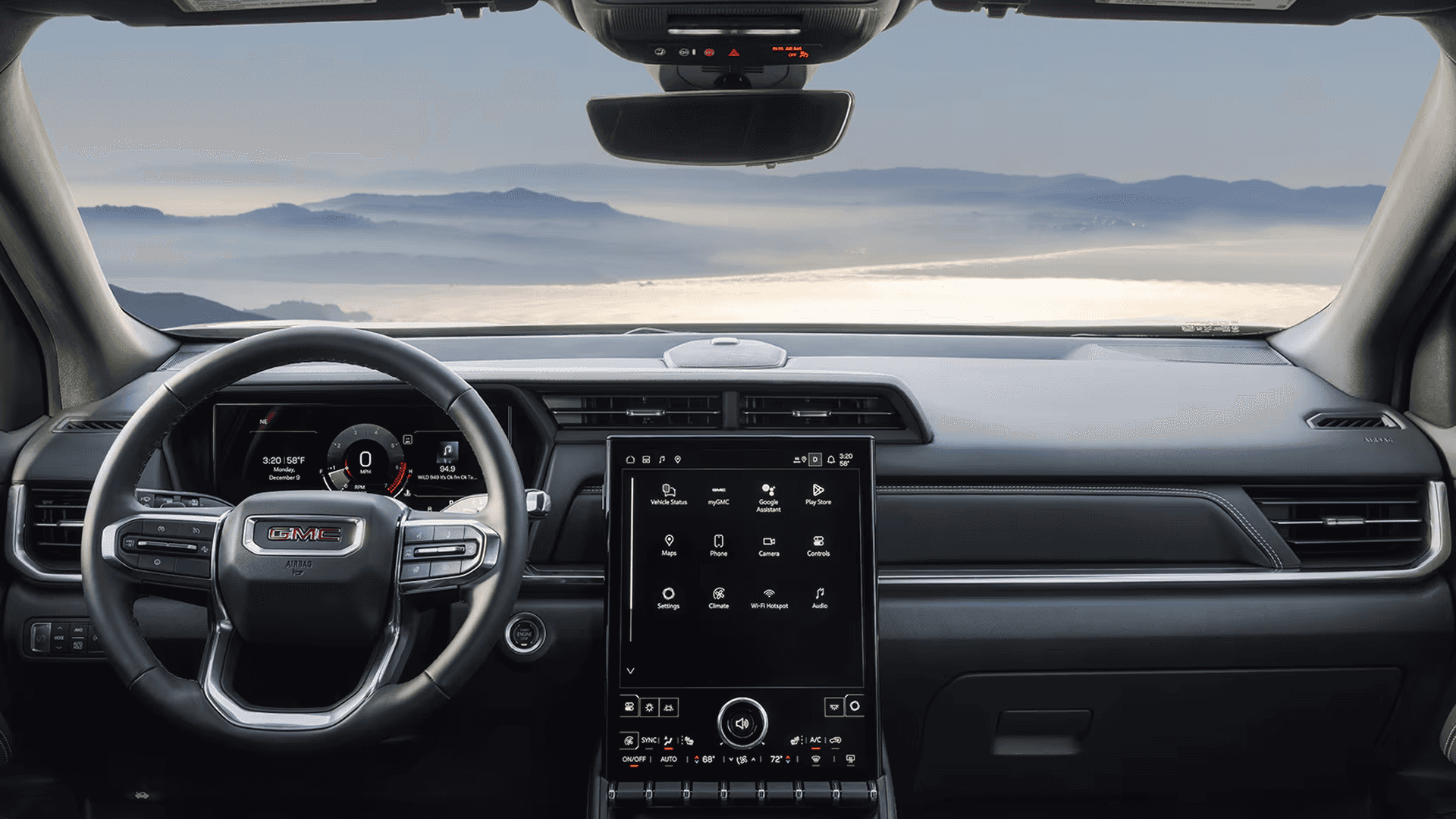 Wide interior view of the 2026 GMC Terrain dashboard with digital driver display, vertical touchscreen, and steering wheel