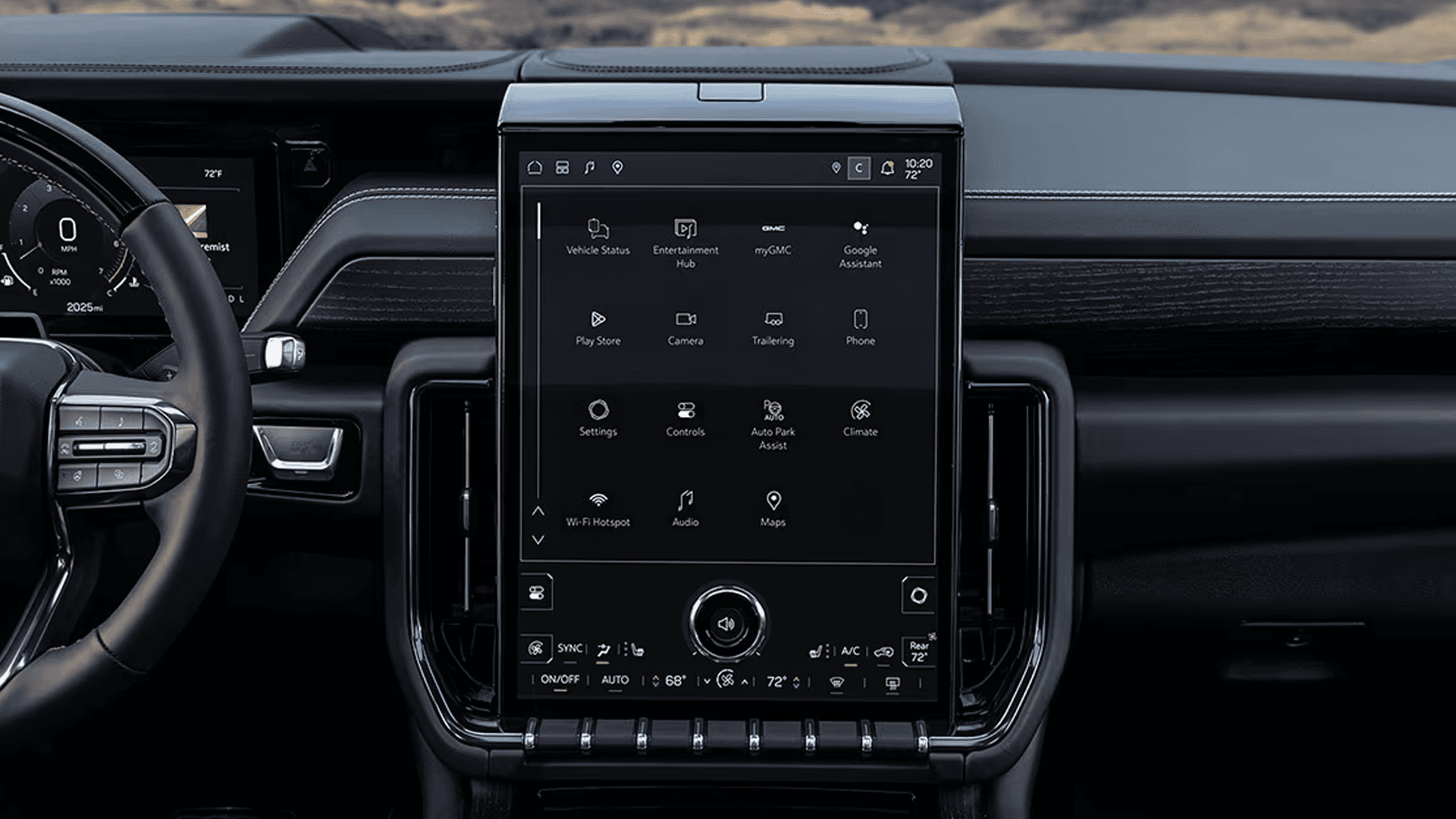 Close-up of large vertical infotainment touchscreen displaying apps and controls in the center of the dashboard.