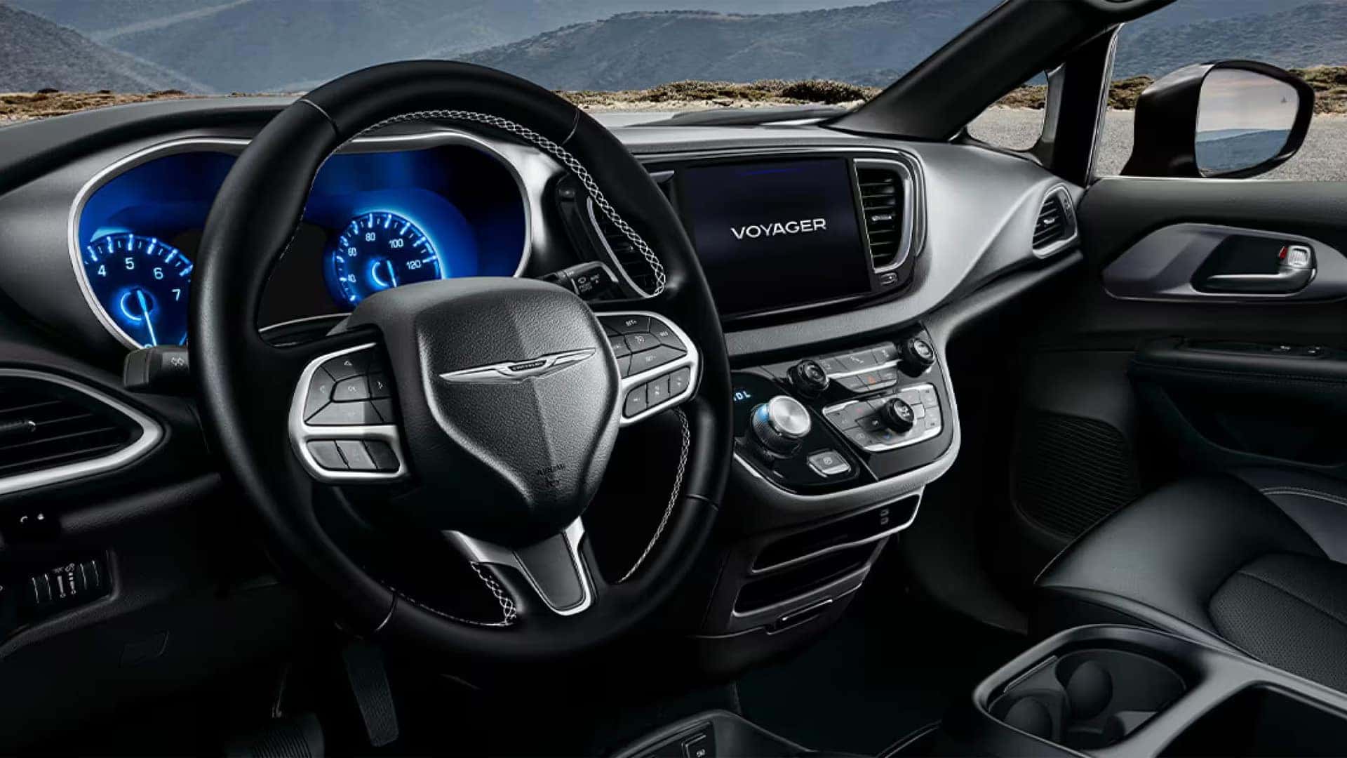 Driver cockpit of the 2026 Chrysler Voyager with 10.1-inch Uconnect 5 touchscreen and digital instrument cluster