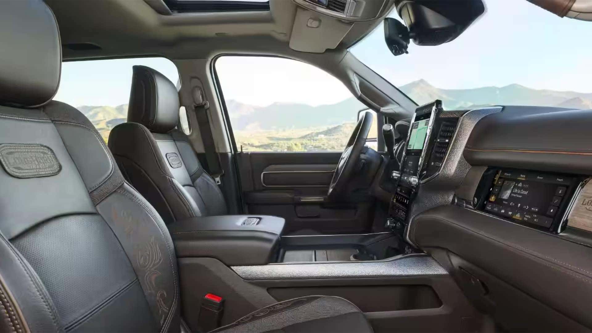 2026 Ram 3500 interior with premium front seats, center console, and large touchscreen display