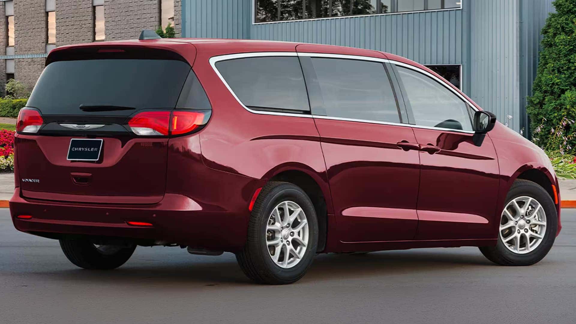 Red 2026 Chrysler Voyager rear three quarter view showing taillamps, liftgate design, and rear body styling
