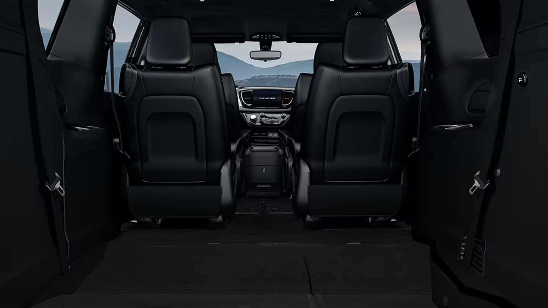 2026 Chrysler Voyager interior with rear seats folded flat to highlight cargo space and Stow ’n Go seating