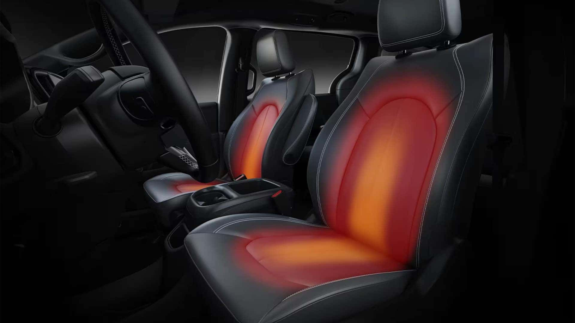 Heated front seats inside the 2026 Chrysler Voyager with illuminated seat heating zones for driver and passenger