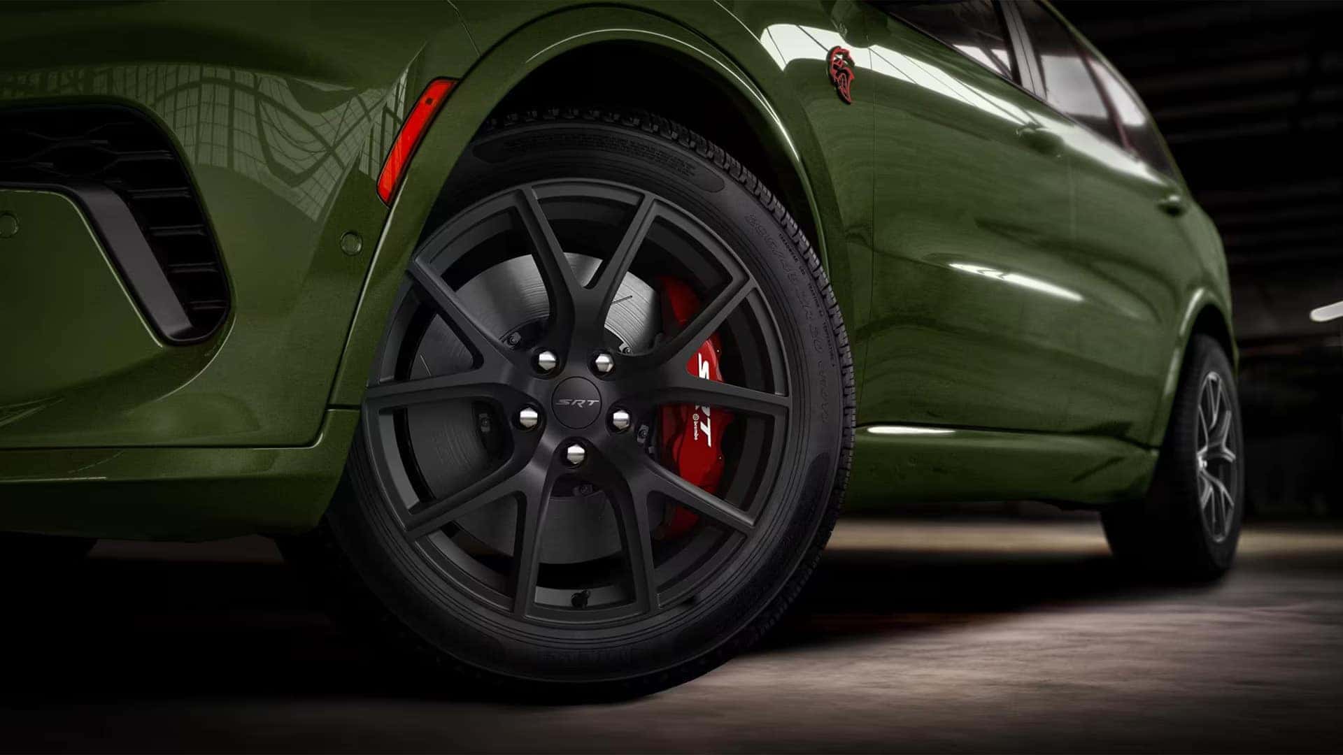 Close up of black performance wheel and red Brembo brake caliper on the 2026 Dodge Durango SRT Hellcat