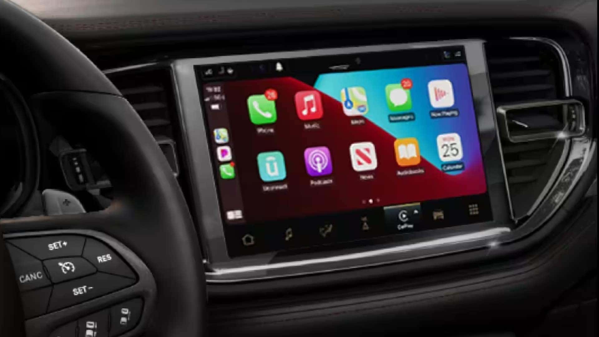 2026 Dodge Durango touchscreen displaying Apple CarPlay interface with smartphone apps on the Uconnect infotainment system