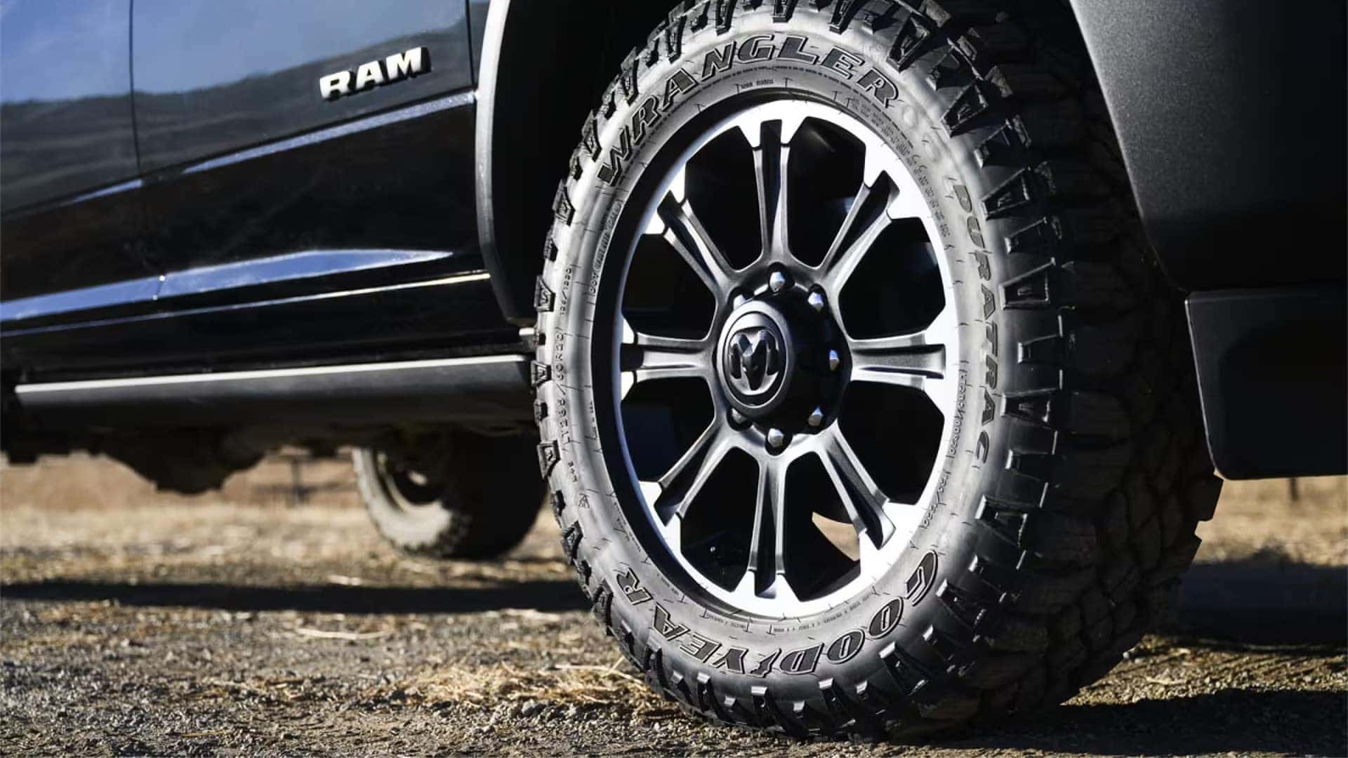 Close up of 2026 RAM 2500 alloy wheel with Goodyear Wrangler all terrain tire and rugged truck stance