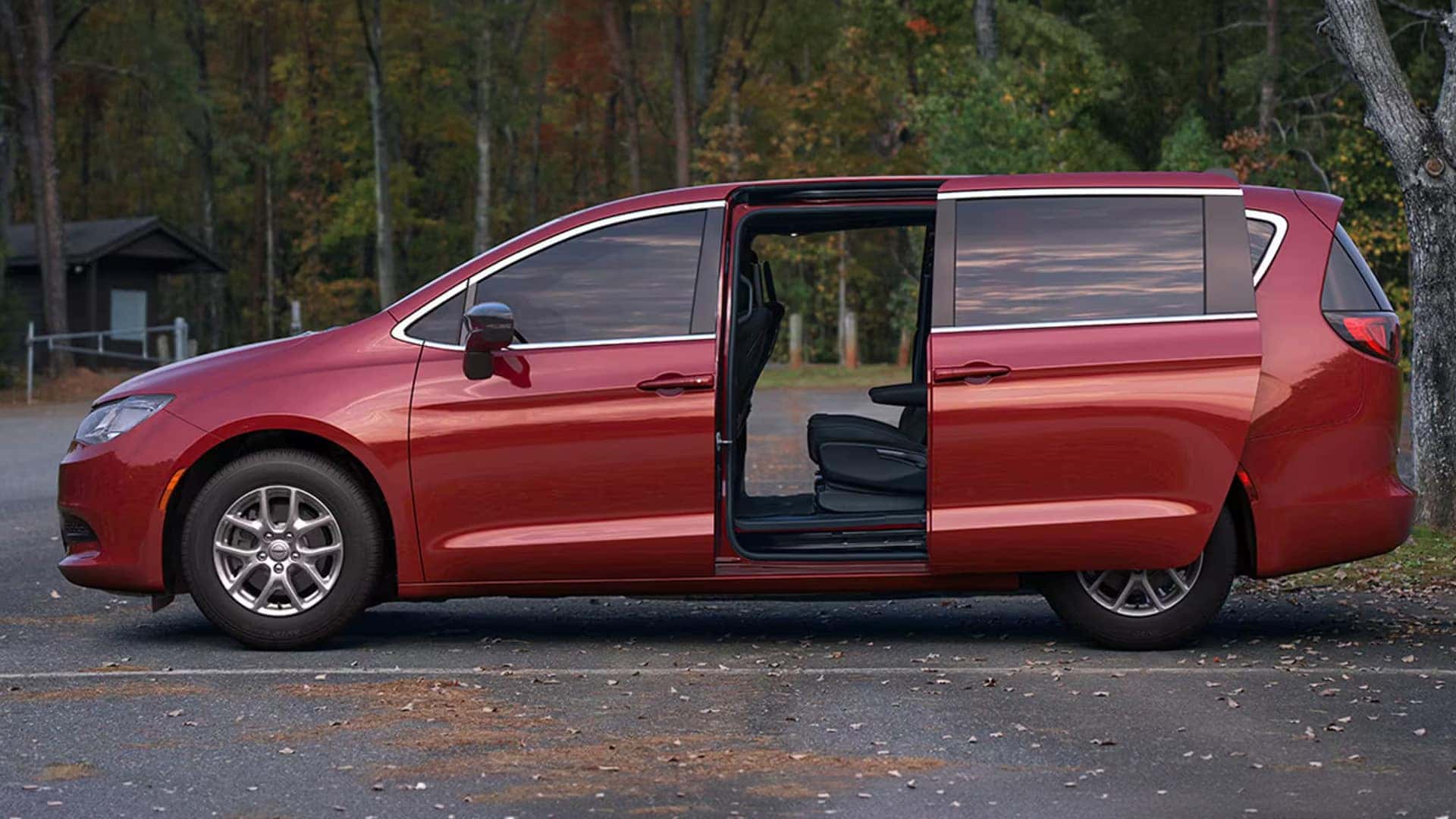 Red 2026 Chrysler Voyager side profile with power sliding door open, highlighting passenger access and exterior proportions