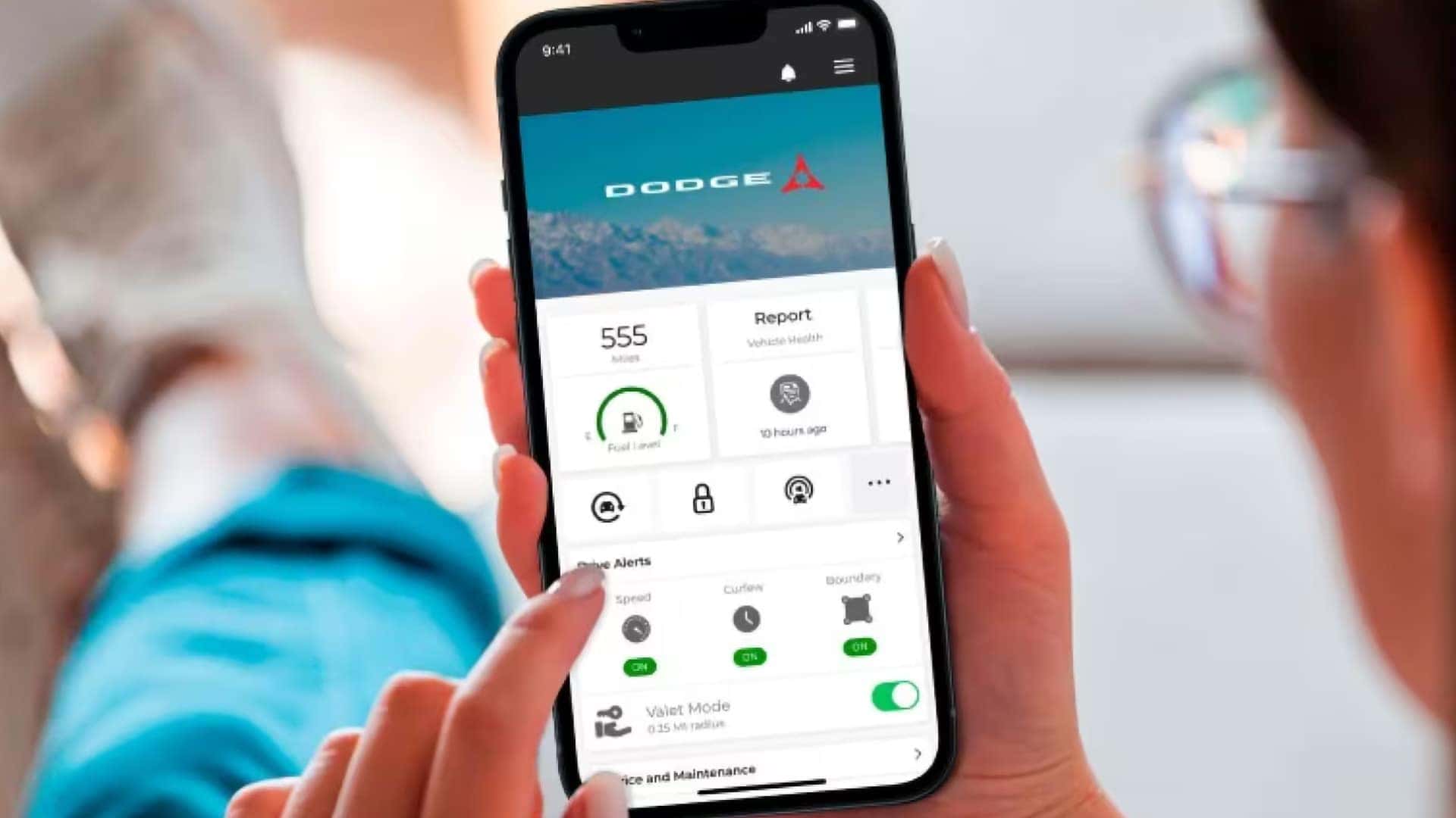Dodge smartphone app showing remote vehicle information, fuel level, vehicle health report, and remote commands