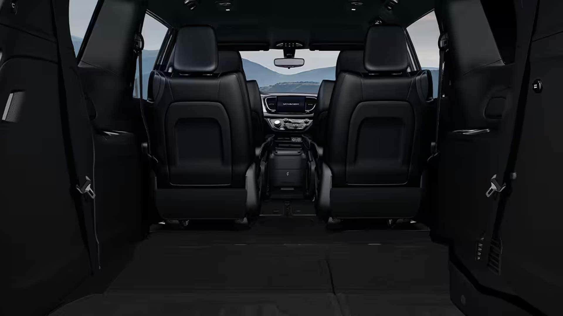In-floor Stow ’n Go storage compartment in the 2026 Chrysler Voyager holding personal items beneath the second-row seat