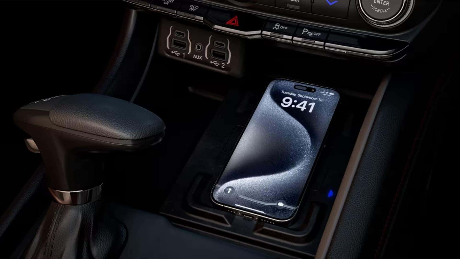 2026 Dodge Durango center console with wireless smartphone charging pad, USB ports, and gear selector