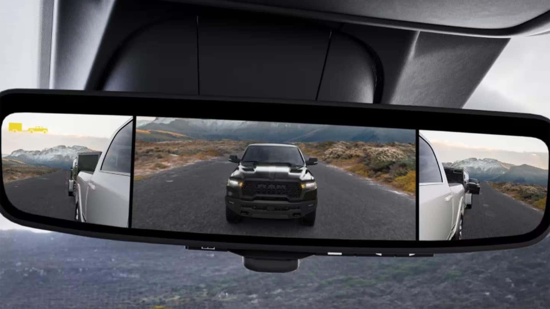 Digital rearview mirror in a 2026 Ram 2500 showing camera views while towing a trailer