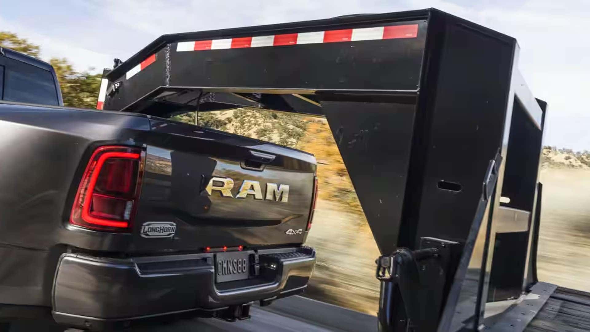 2026 Ram 3500 towing a heavy duty gooseneck trailer demonstrating fifth wheel towing capability