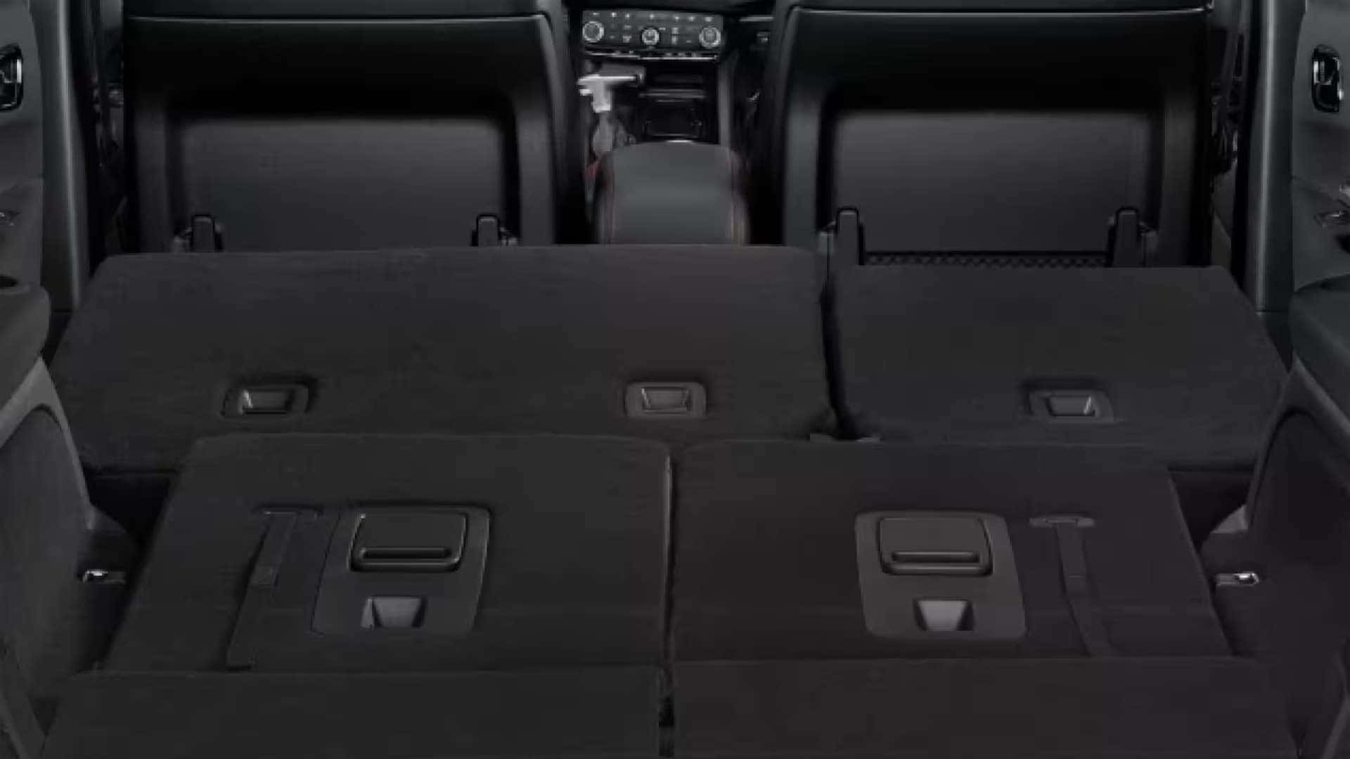 Interior cargo area of the 2026 Dodge Durango with rear seats folded flat to expand cargo capacity and storage space.