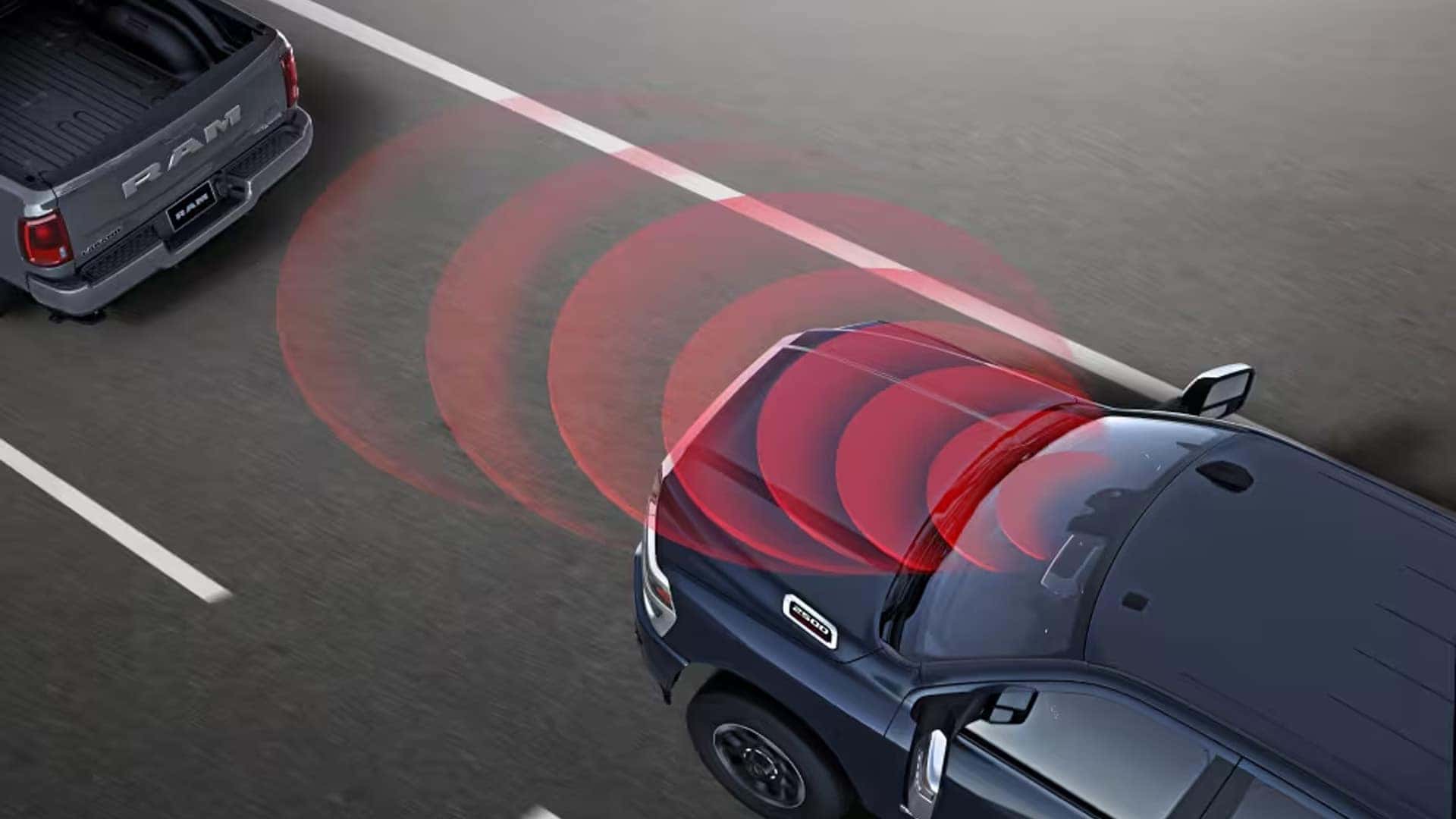 Driver assist visualization for the 2026 RAM 2500 showing safety sensors detecting a vehicle ahead on the highway