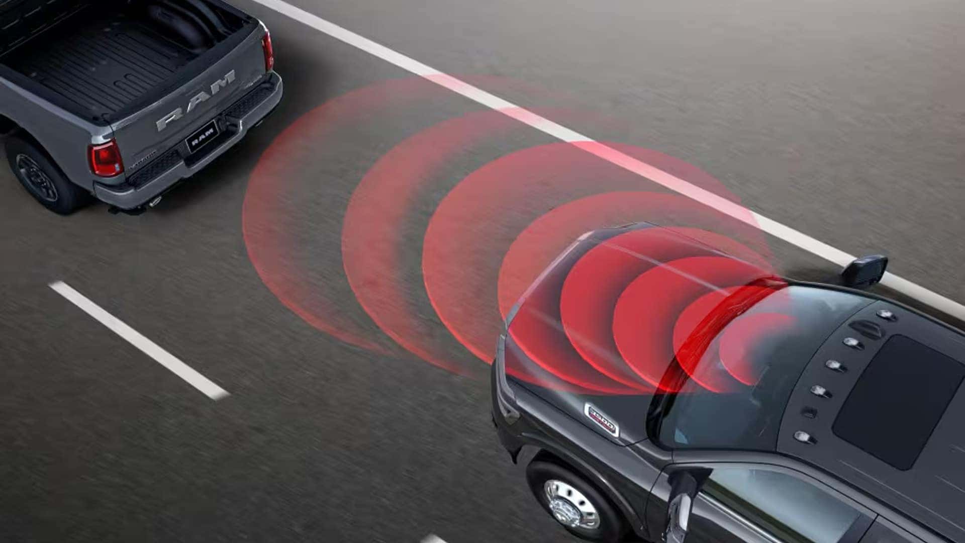 2026 Ram 3500 safety technology graphic showing rear awareness sensors detecting traffic behind the truck