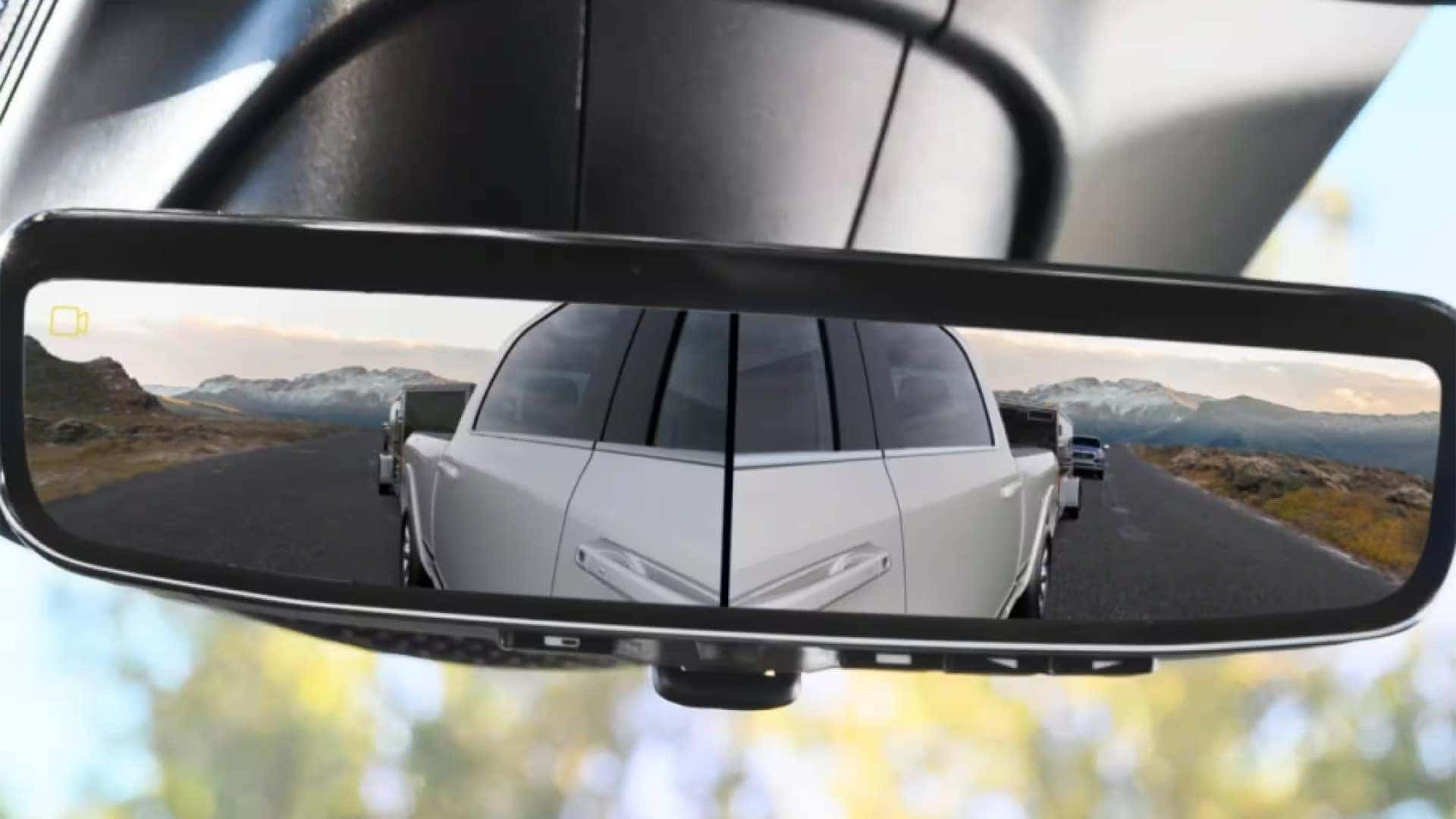 2026 Ram 3500 digital rearview mirror displaying camera view while towing a trailer