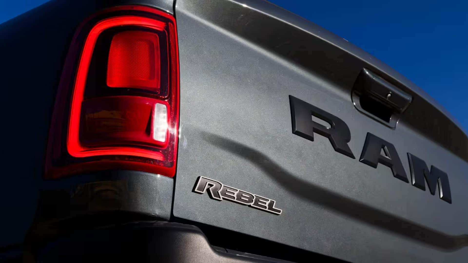 Rear view of a RAM 2500 Rebel tailgate with LED taillight and Rebel badge showing rugged heavy duty truck styling