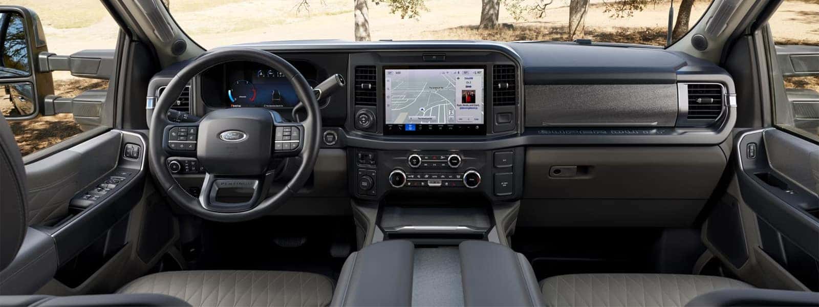 Interior of the 2026 Ford F-350 Super Duty showing dashboard layout, digital driver display, center touchscreen, and steering wheel controls