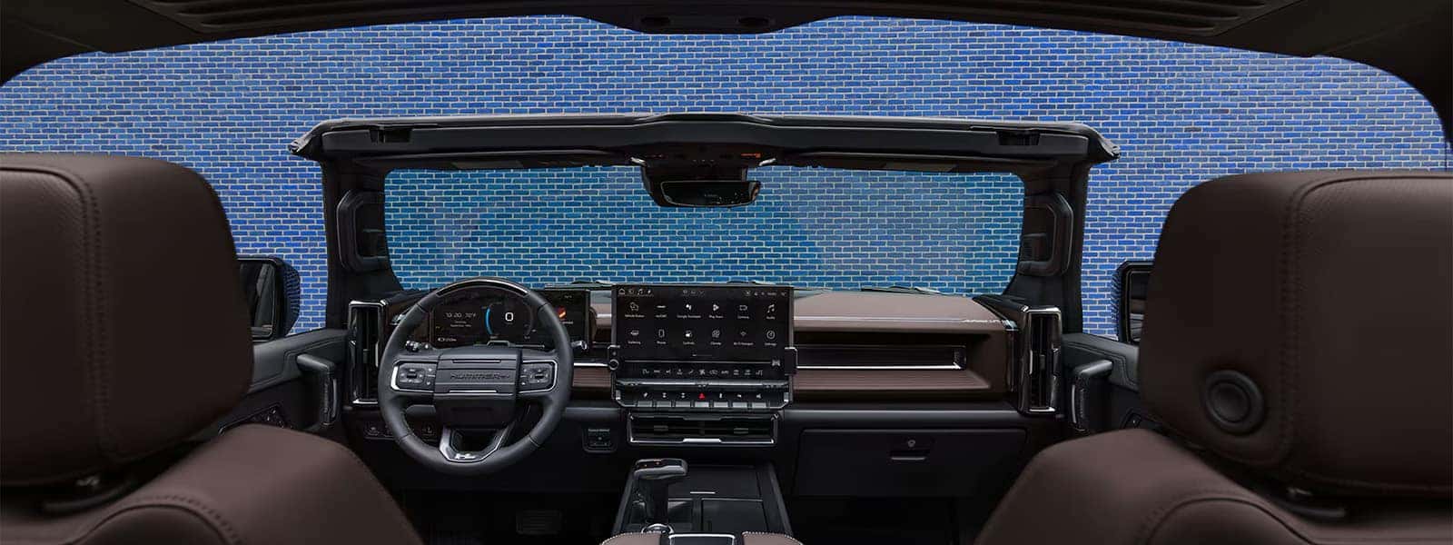 2026 GMC HUMMER EV SUV interior with open roof panels, digital driver display, and large center touchscreen