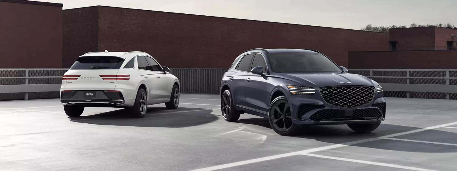 2026 Genesis GV70 SUVs in a rooftop parking lot, showing front and rear views with luxury styling and sport design details