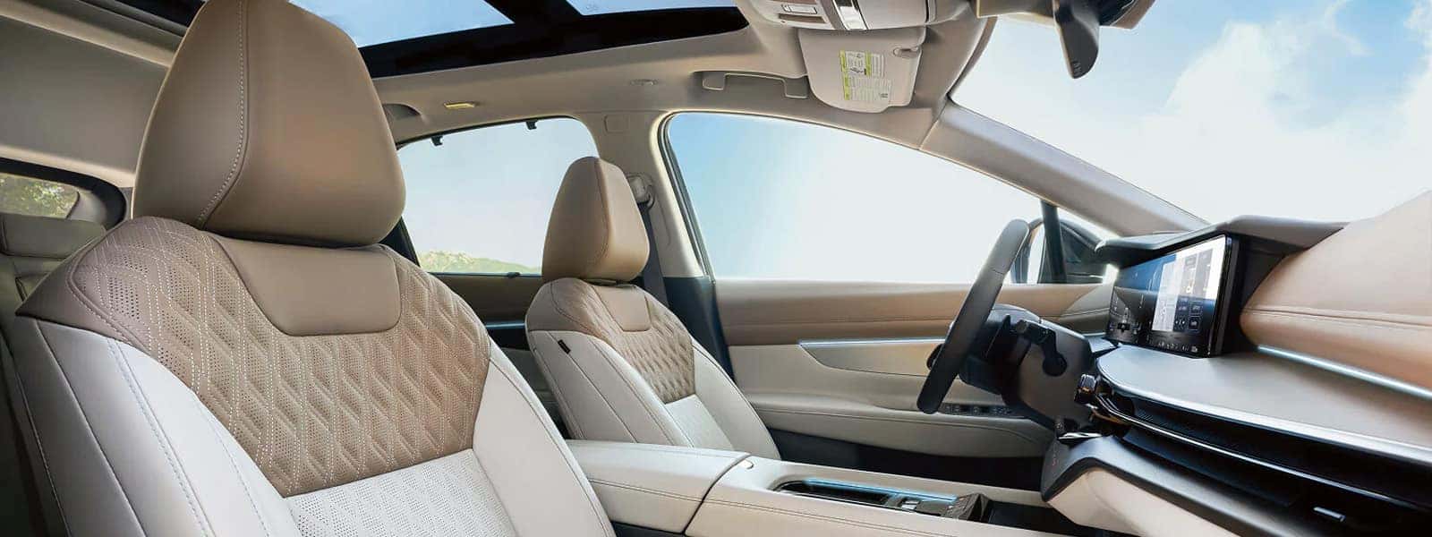 2026 Nissan Murano interior with quilted front seats, panoramic moonroof, and dual digital displays