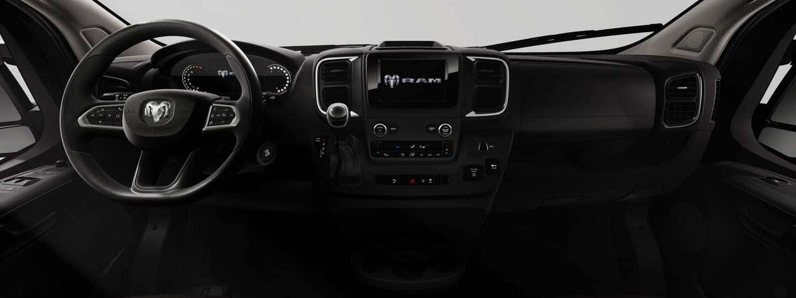 2026 RAM ProMaster Cargo Van interior dashboard with steering wheel, instrument cluster, and center touchscreen display