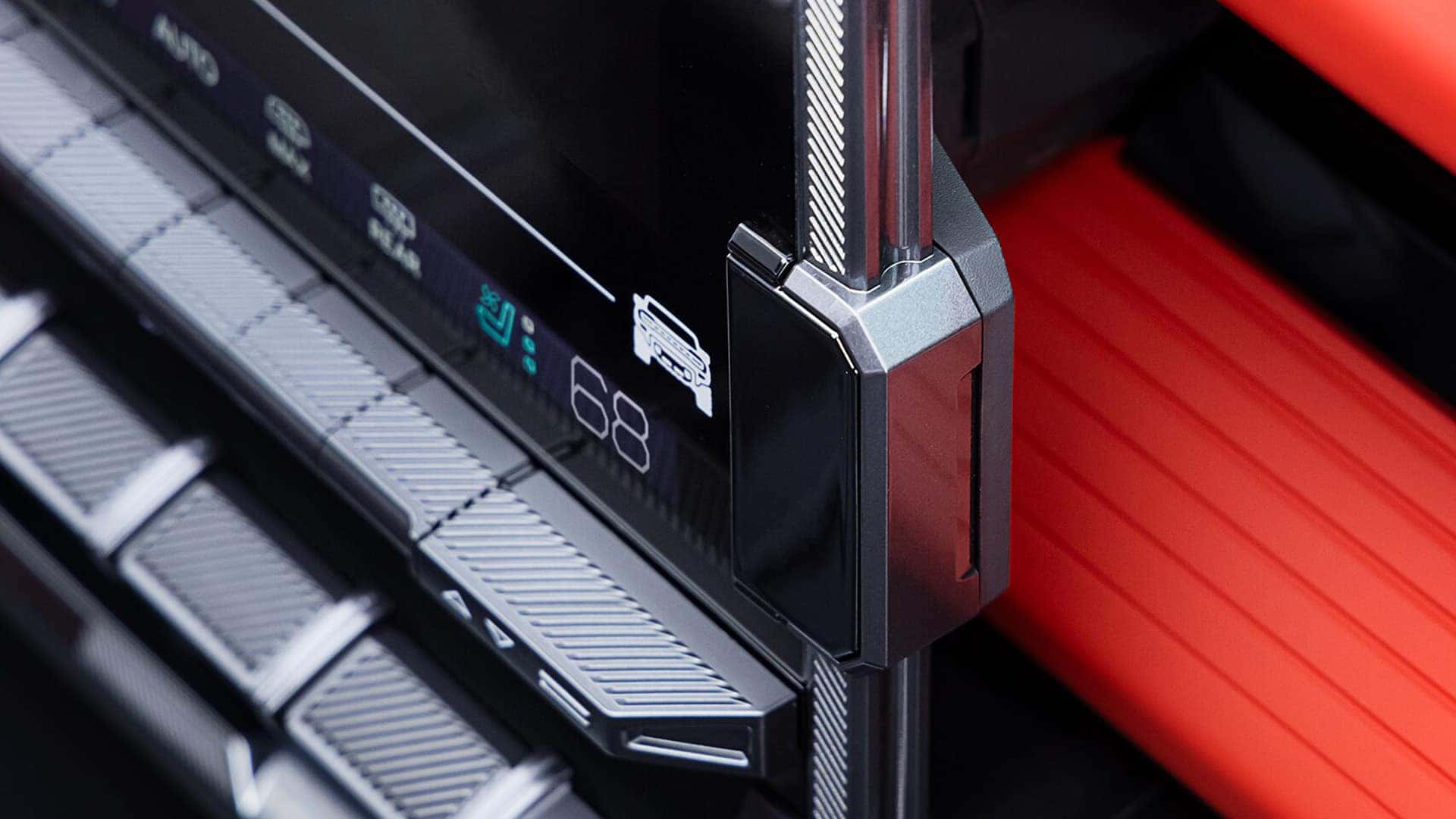 Close-up of 2026 GMC HUMMER EV SUV infotainment controls and touchscreen interface with climate and vehicle settings