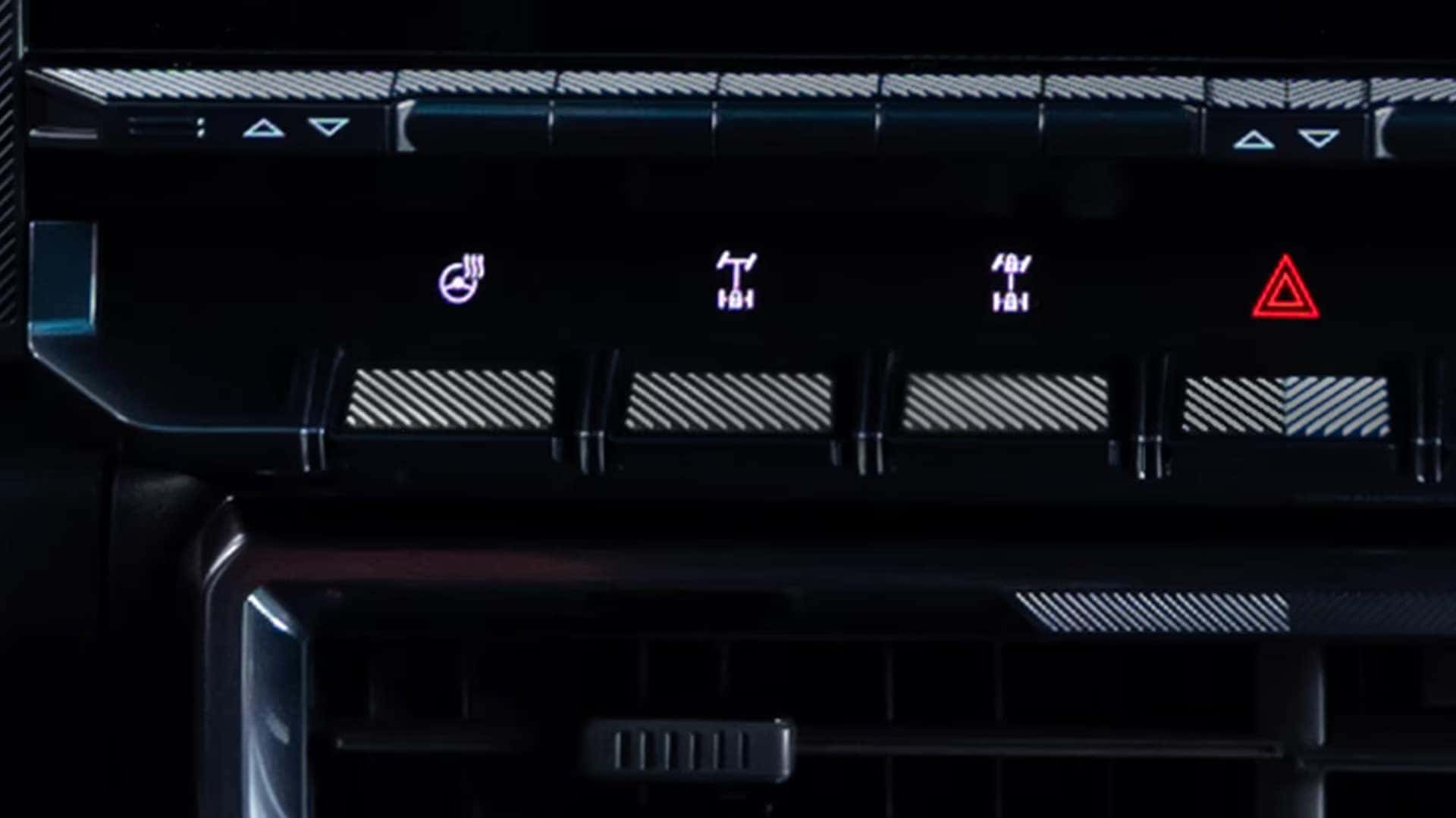 2026 GMC HUMMER EV SUV center dash controls showing toggle switches for vehicle functions and hazard lights