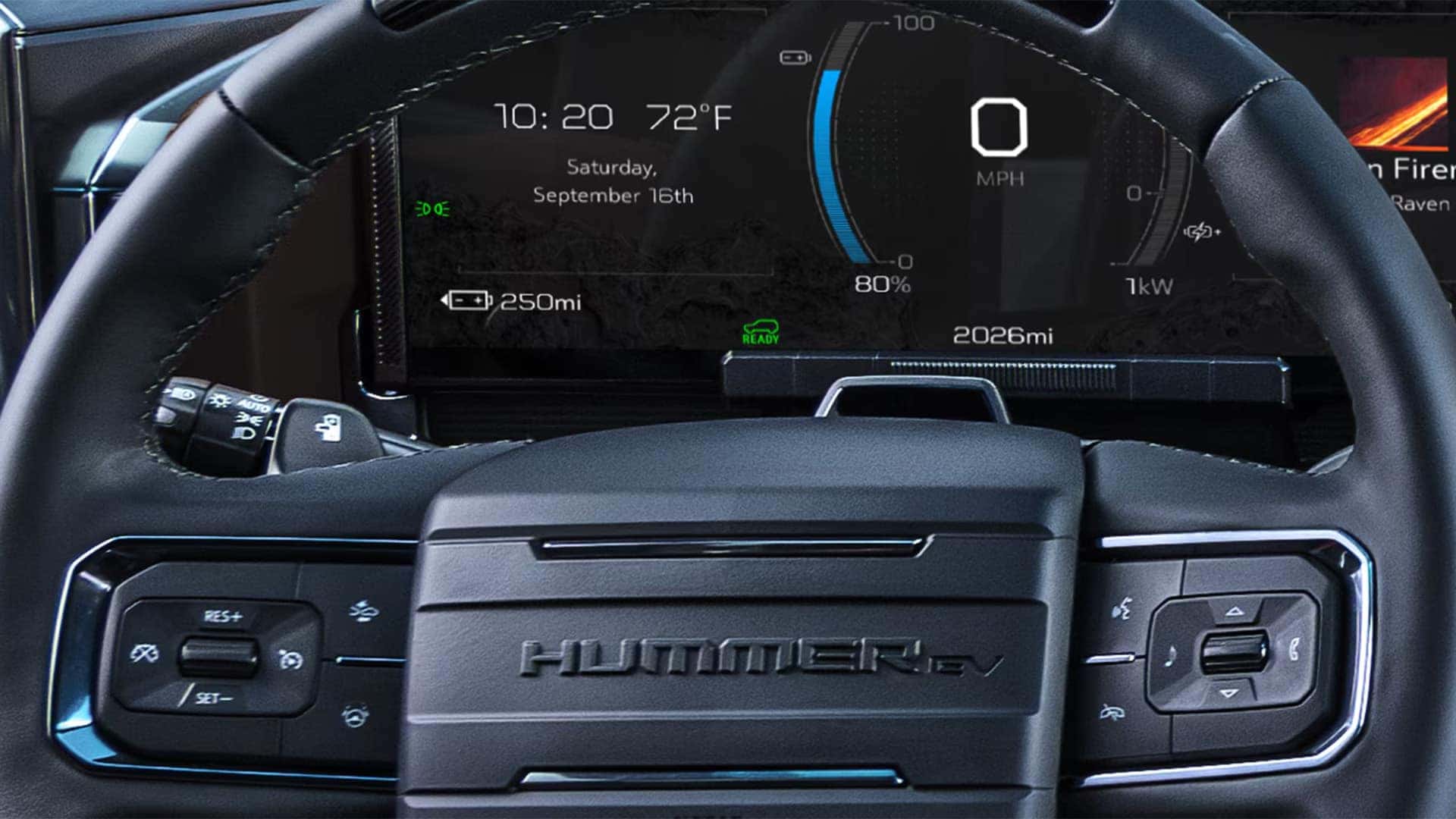 Close-up of 2026 GMC HUMMER EV SUV digital driver information center showing battery range, speed, and EV performance data behind the steering wheel