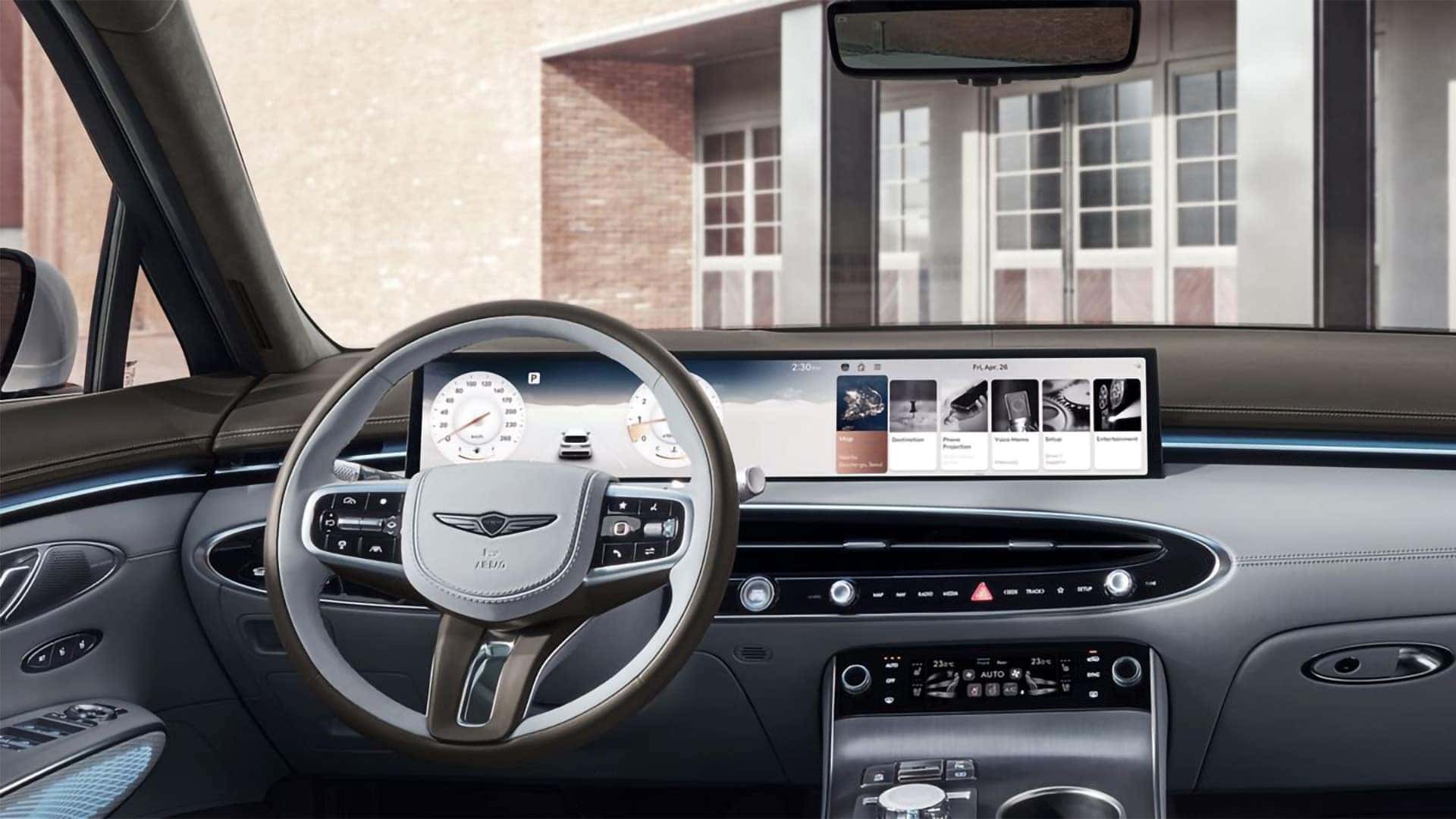 2026 Genesis GV70 driver cockpit with 27-inch OLED display, digital gauges, and premium steering wheel controls