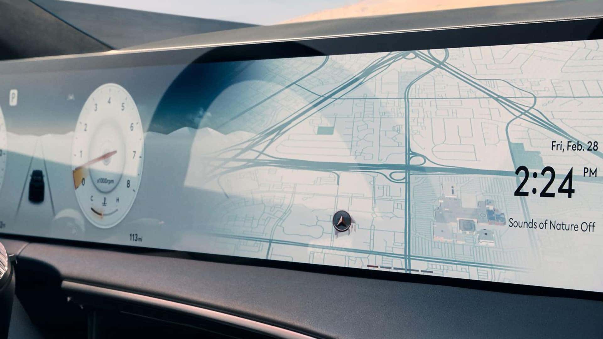 2026 Genesis GV70 27-inch OLED display showing navigation map, digital gauges, time, and media information