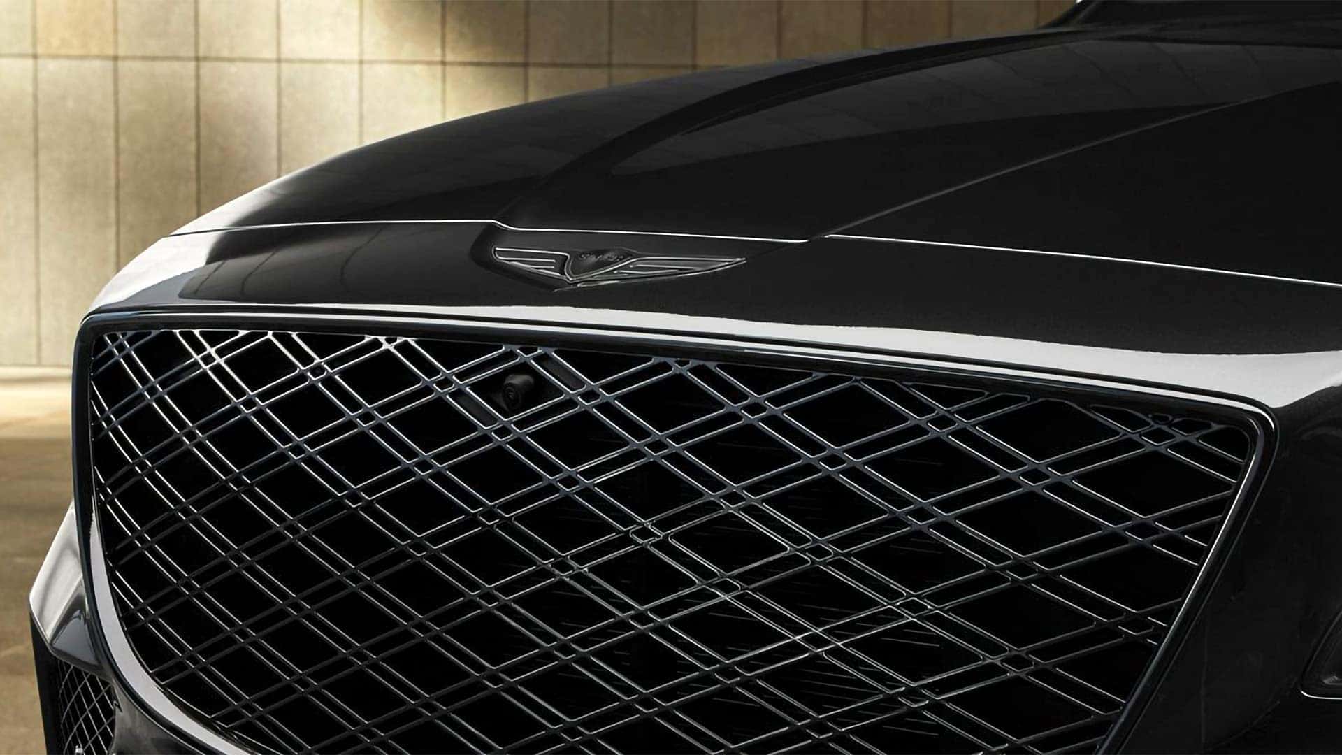 Close up of 2026 Genesis GV80 Crest Grille with G-Matrix pattern and Genesis emblem on hood