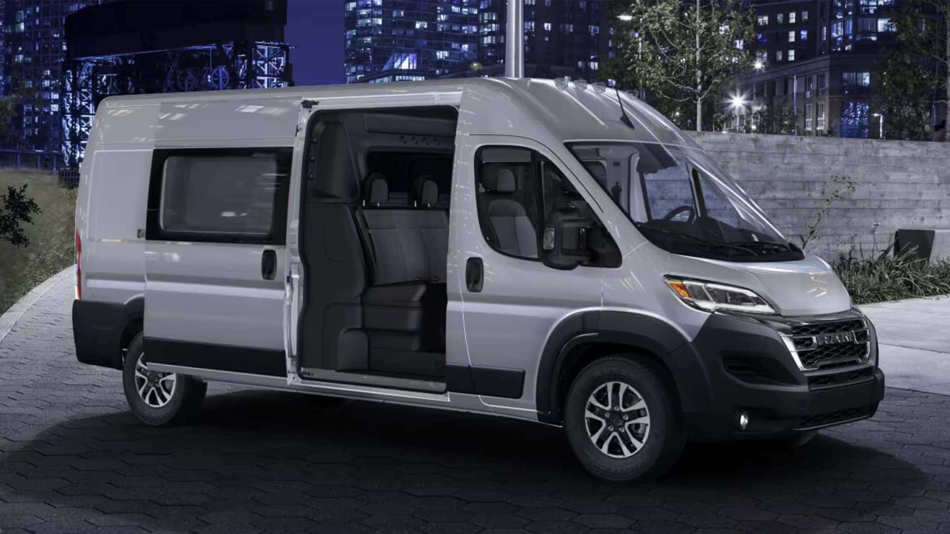 2026 RAM ProMaster Cargo Van exterior side view with sliding door open at night