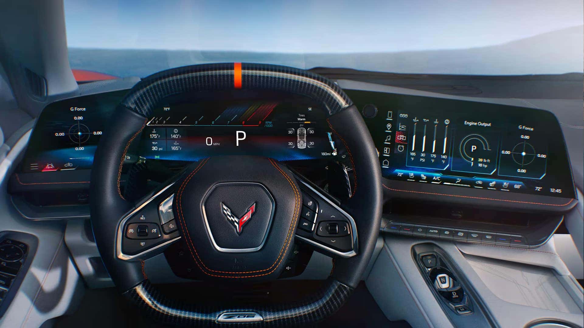 Driver view of Corvette steering wheel with digital gauges and wide display showing vehicle data and interface menus