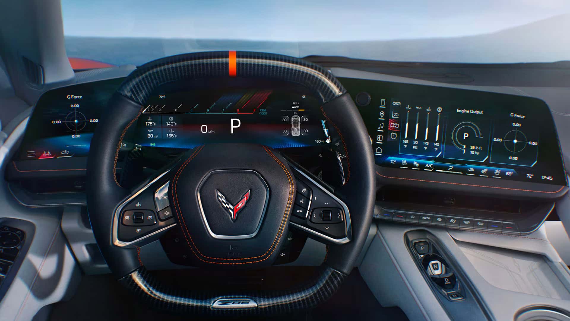 Driver-facing view of the 2026 Corvette Z06 showing the carbon fiber steering wheel, 6.6-inch auxiliary display, 14-inch driver information center, and 12.7-inch center touchscreen.